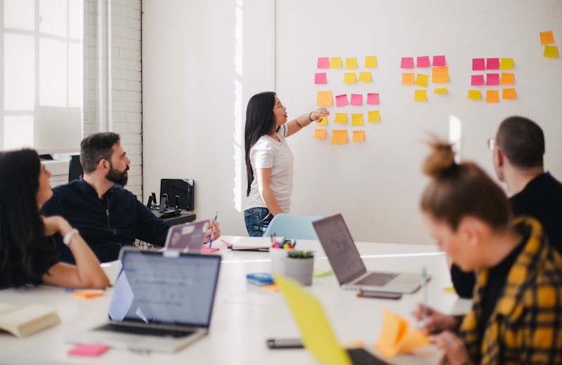 Cross-disciplinary marketing team collaborating in a strategy session