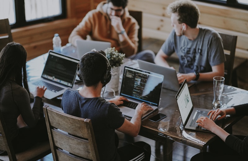 Diverse agency team planning a multi-channel campaign roadmap